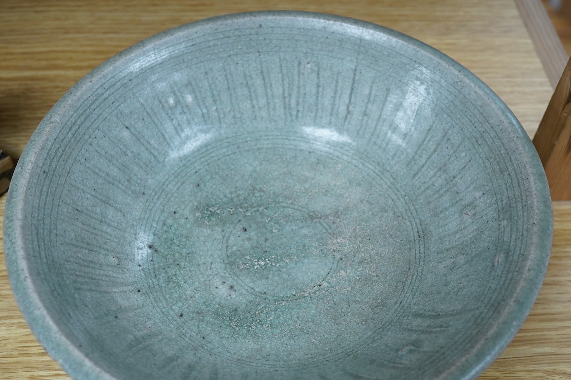 A Vietnamese glazed bowl with incised decoration, 23cm in diameter